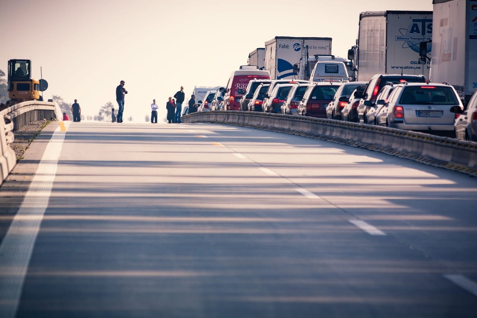 Traffic backed up on a highway on a hot, hazy day
